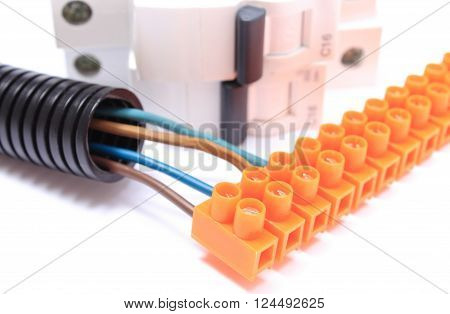 Corrugated plastic pipe cable with connection block and electric fuse copper wire connections components for use in electrical installations energy concept