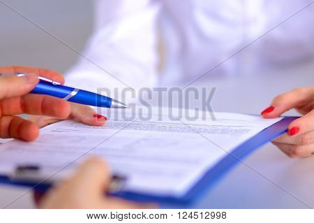 Business meeting -  manager discussing work with his colleagues.