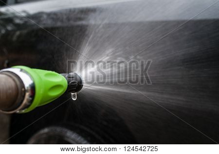 Washing Vehicle with Green Nozzle Car Wash