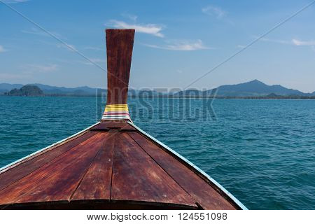 Thai Wooden Head Longtail Boat Heads Toward