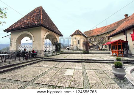 BLED, SLOVENIA - APRIL 30, 2013: Bled Castle on April 30, 2013 in Bled, Slovenia. Located at the Julian Alps, Bled Castle is a major tourist attraction in Slovenia.