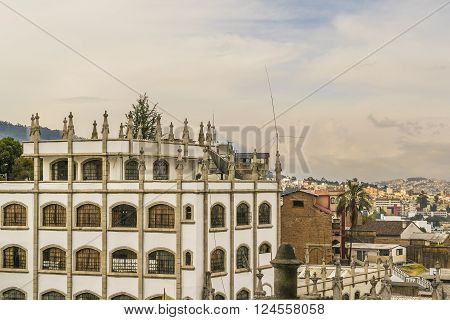 Cityscape aerial view of historic center of Quito city from the top of San Juan Basilica church.