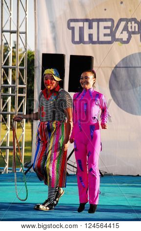 ANKARA/TURKEY-JULY 2, 2011: Harlequin and female acrobat at the stage during the Ankara Shopping Festival. July 2, 2011-Ankara/Turkey