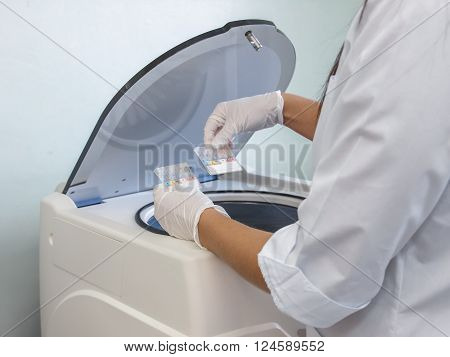 placing the samples in a centrifuge for controlling the quality of harvested blood