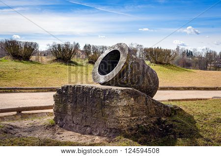 Old iron cannon on a pedestal in Bauska town, Latvua