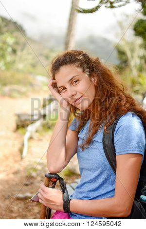 tired girl resting on a hiking trip