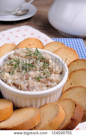 Appetizer of fish paste (forshmak ) with slices of dried baguette