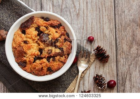 Bread pudding in a white ramekin top view flat lay