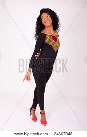 Beautiful African American woman fashion portrait over gray background