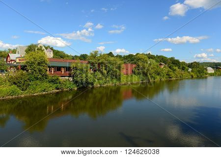 Winooski River cross the center of Montpelier in summer, Montpelier, Vermont, USA. Montpelier is the capital of Vermont and is the smallest capital city in the United States.