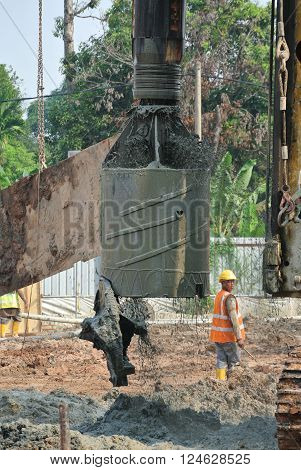 MALACCA, MALAYSIA - MARCH 12, 2015: Bore pile rig machine at the construction site in Malacca, Malaysia. The machine used to driven pile for building foundation work.
