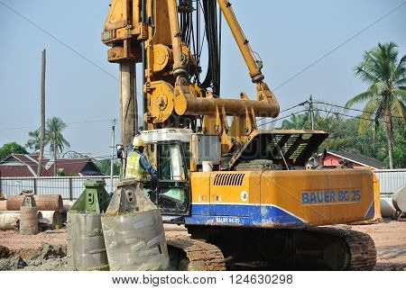 MALACCA, MALAYSIA - MARCH 12, 2015: Bore pile rig machine at the construction site in Malacca, Malaysia. The machine used to driven pile for building foundation work.