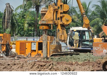 MALACCA, MALAYSIA - MARCH 12, 2015: Bore pile rig machine at the construction site in Malacca, Malaysia. The machine used to driven pile for building foundation work.