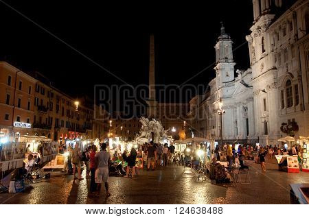 ROME-AUGUST 7: Piazza Navona on August 7 2013 in Rome. Piazza Navona is a city square built on the site of the Stadium of Domitian in 1st century AD in Rome Italy.