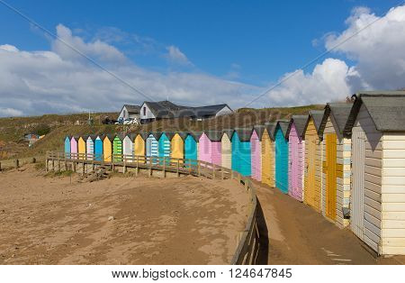 Colourful pastel beach huts on the beach Bude North Cornwall England uk beautiful day