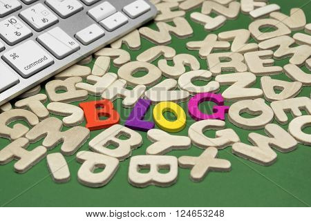 Blog Sign On Green Background With Different Letters And Keyboard