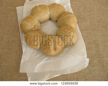 Homemade roll wreath on white greaseproof paper