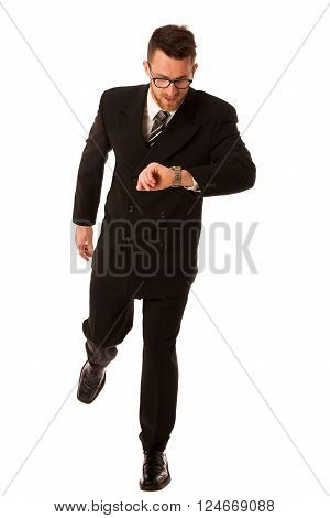 Successful businessman in formal suit chacking time on wrist watch isolated over white.