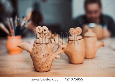 children's hands sculpts clay crafts pottery school