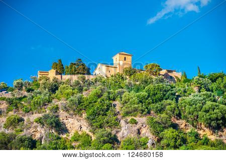 Beautiful view of a small mountain village Deia in Mallorca, Spain. Houses built on hills in Deia mountain village in Majorca island, Spain.