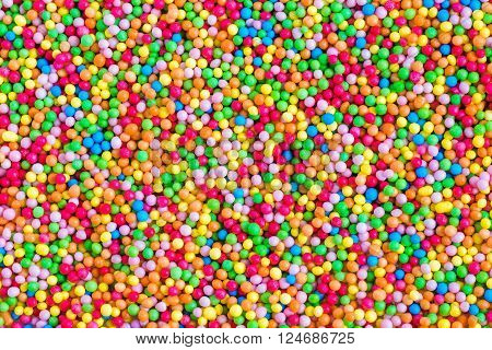 Sugar sprinkle dots, decoration for cake and bekery, a lot of sprinkles as a background