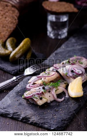Sliced Herring On A Black Slate Plate