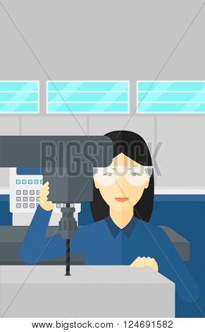 Woman working with boring mill.