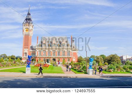 CALAIS FRANCE - SEPTEMBER 15 2012: View of the town hall with locals and visitors in Calais France