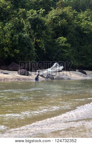 AGONDA, INDIA - OCTOBER 13, 2015: Unidnetified sea shore fisherman at Agonda beach India. Agonda is a traditional fishing village.