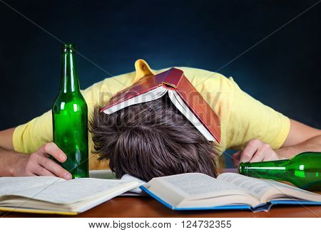 Student with the Beer sleep on the Books