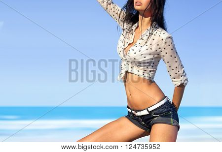 part of beautiful woman in sexy wear on beach of ocean