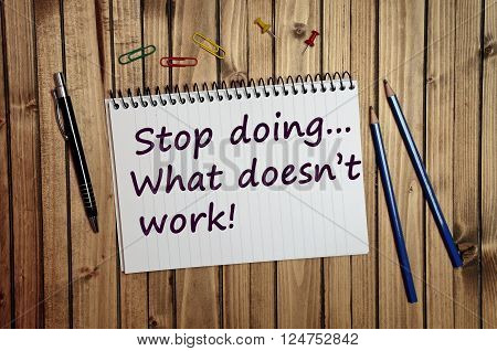 Stop doing what doesn't work text written on notebook