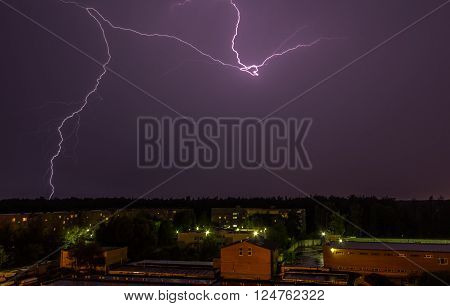 Lightning over the sky in the city