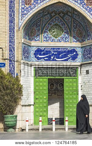 Esfahan Iran - February 8,  2016 - Muslim woman with traditional chador on the street. Iran 2016