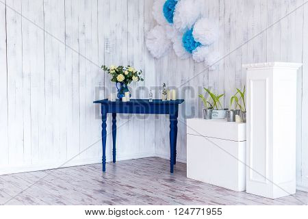 roses in a blue vase on a blue table with a white wooden background.
** Note: Visible grain at 100%, best at smaller sizes
