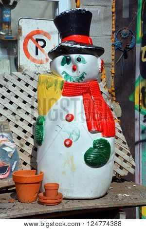 MONTREAL QUEBEC CANADA APRIL 02 2016: Wierd sonw man in plastic is spring time.