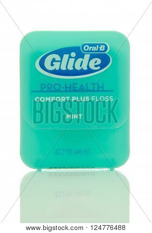 Winneconne, WI - 6 April 2016: Package of Oral-B glide dental floss on an isolated background.