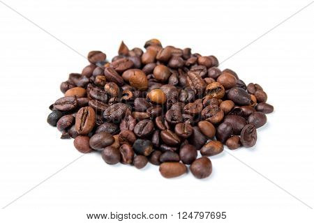 Roasted coffee beans on a white background