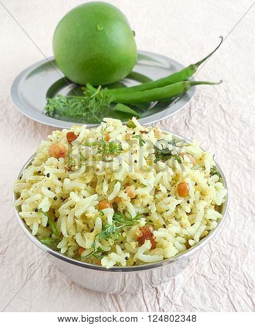Indian food raw mango rice, which is a traditional and popular dish, is especially made on the festival day of Ugadi.