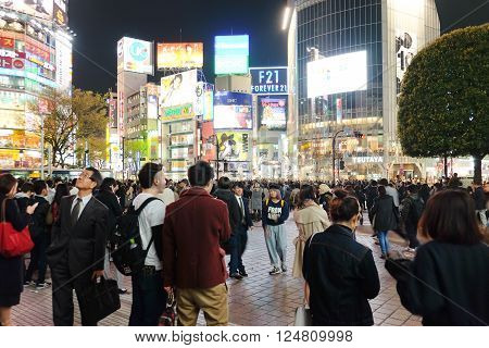 Tokyo, Japan - March 29, 2016: Shibuya Crossing at Night, Crowds of people at Shibuya Crossing on 29 March 2016 in Tokyo, Japan. Shibuya Crossing is one of the busiest crosswalks in the world.