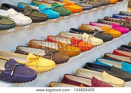 variety of the colorful leather shoes in the shop