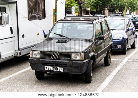 OVADA, FRANCE - AUGUST 7, 2014: Compact motor car Fiat Panda in the city street.