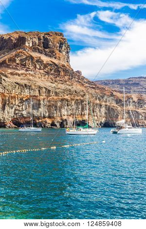 Cliff And Yachts On The Sea - Puerto de Mogan Gran Canaria Canary Islands Spain