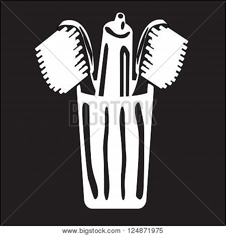 stencil toothpaste and toothbrush in a glass on a black background