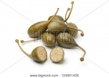 Heap of pickled caperberries on white background