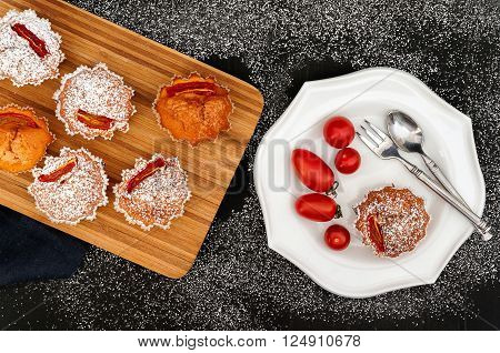 Sweet Tomato Spice Muffins on dark background