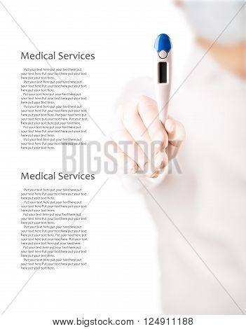 Doctor holds an electronic thermometer for temperature measurement (with copy space)