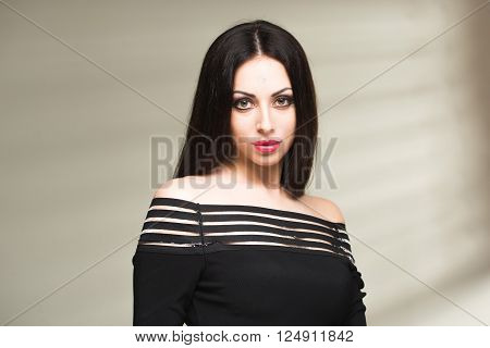sexy girl model with shadow from the blinds