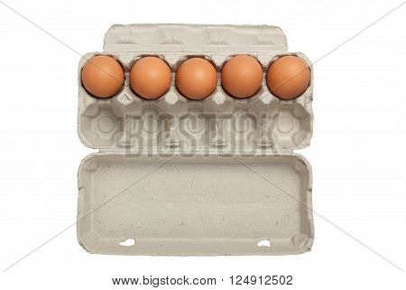 Egg carton half full or half empty of eggs isolated on white background