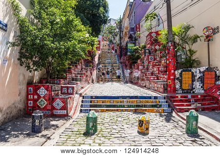 Rio de Janeiro, Brazil - December 21, 2012: Tourists on the Stairway Selaron in Lapa, Rio de Janeiro, Brazil. It's world-famous work of Chilean artist Jorge Selaron who declared it as 